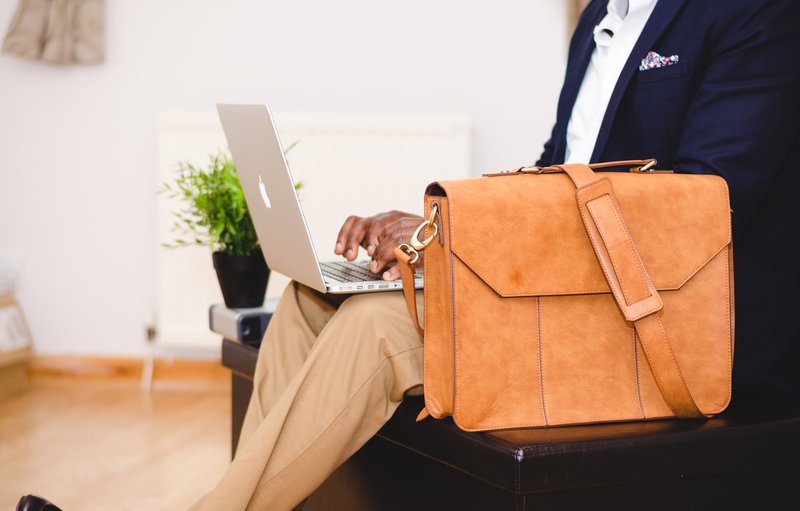 Businessman typing on a laptop